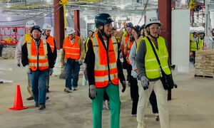 Governor Reynolds in construction gear at Des Moines Airport