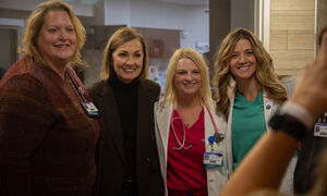 Governor Reynolds with doctor and nurse