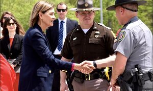 Governor Reynolds shaking hands with law enforcement officer