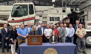 Governor Reynolds signing the UI reform bill