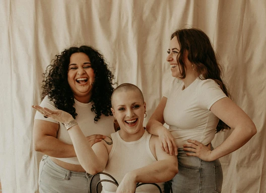 Three women gathered around